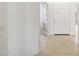 Entryway featuring tile floors and white doors, creating a bright and airy space at 35402 N 32Nd Dr, Phoenix, AZ 85086