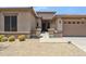 Close-up of a home's exterior with desert landscaping and a covered entryway at 35402 N 32Nd Dr, Phoenix, AZ 85086