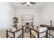 Modern office area features ceiling fan, natural light, and stylish decor for a productive workspace at 35402 N 32Nd Dr, Phoenix, AZ 85086
