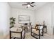 A bright home office features ceiling fan, natural light, and stylish decor for comfortable workspace at 35402 N 32Nd Dr, Phoenix, AZ 85086