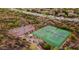 Aerial view featuring basketball and tennis courts surrounded by desert landscape and residences at 35402 N 32Nd Dr, Phoenix, AZ 85086