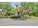 Community clubhouse surrounded by lush landscaping and mature trees, creating an inviting gathering space at 3830 E Lakewood E Pkwy # 3014, Phoenix, AZ 85048