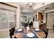 Charming dining area with a round wood table and access to both the kitchen and living room at 3830 E Lakewood E Pkwy # 3014, Phoenix, AZ 85048