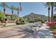 Attractive entrance to the Portofino Condominiums with lush landscaping and a welcoming sign at 3830 E Lakewood E Pkwy # 3014, Phoenix, AZ 85048