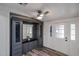Inviting entryway with a built-in storage unit, a ceiling fan, and french doors at 4065 E University Dr # 436, Mesa, AZ 85205