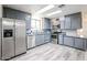 Modern kitchen with gray cabinets and stainless steel appliances at 4065 E University Dr # 436, Mesa, AZ 85205
