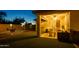 Cozy covered patio with comfortable seating, overlooking a manicured backyard at 41793 W Canasta Ln, Maricopa, AZ 85138