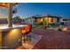 Backyard showcasing a covered patio and outdoor kitchen with bar seating at 41793 W Canasta Ln, Maricopa, AZ 85138