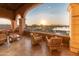Enjoy this sunrise view from this attractive balcony overlooking a lake with ample space for relaxing and entertaining at 41793 W Canasta Ln, Maricopa, AZ 85138