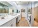 Bright bathroom with dual sinks, spacious shower, and large walk-in closet at 41793 W Canasta Ln, Maricopa, AZ 85138