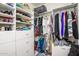 Spacious walk-in closet featuring custom shelving and ample storage solutions at 41793 W Canasta Ln, Maricopa, AZ 85138