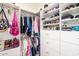 Well-organized walk-in closet with custom shelving and ample hanging space at 41793 W Canasta Ln, Maricopa, AZ 85138