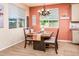 Cozy dining room featuring a modern light fixture and a large window overlooking the backyard at 41793 W Canasta Ln, Maricopa, AZ 85138