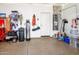 Well-maintained garage with epoxy flooring and plenty of storage space at 41793 W Canasta Ln, Maricopa, AZ 85138