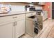 Kitchen offers ample storage, including a pull-out organizer for pots and pans at 41793 W Canasta Ln, Maricopa, AZ 85138