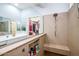 View of updated shower with frameless glass and a convenient built-in bench at 41793 W Canasta Ln, Maricopa, AZ 85138
