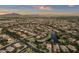 Expansive aerial view of a residential community with lakes, parks, lush landscaping, and mountain views at 4350 S White Dr, Chandler, AZ 85249