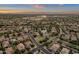 Expansive aerial view of a Primary-planned community with lakes, green spaces, and well-maintained homes at sunset at 4350 S White Dr, Chandler, AZ 85249