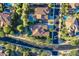 An aerial view showcasing residential neighborhood with pools, well-maintained streets, mature landscaping, and tile roofs at 4350 S White Dr, Chandler, AZ 85249