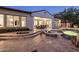 Beautiful outdoor space featuring a covered patio, lounge chairs, and a sparkling pool at dusk at 4350 S White Dr, Chandler, AZ 85249