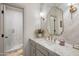 Stylish bathroom with herringbone patterned wall tile, elegant fixtures, and a glass-enclosed shower at 4350 S White Dr, Chandler, AZ 85249