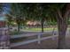 Community park featuring open green space, walking paths, shade trees, decorative rock and lush green grass at 4350 S White Dr, Chandler, AZ 85249