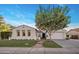 Charming single-Gathering home featuring a well-manicured lawn, mature trees, and a welcoming entrance at 4350 S White Dr, Chandler, AZ 85249