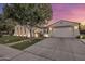 Attractive single-story home boasting a three-car garage, well-maintained lawn, and a mature shade tree at 4350 S White Dr, Chandler, AZ 85249