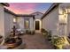 Inviting home entrance with a decorative fountain, seating area, and wrought iron door at 4350 S White Dr, Chandler, AZ 85249