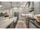 Elegant kitchen featuring custom cabinetry, a large island, and stainless steel appliances for the discerning chef at 4350 S White Dr, Chandler, AZ 85249