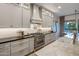 Bright and modern kitchen with updated appliances, sleek countertops, and plenty of cabinet space for storage at 4350 S White Dr, Chandler, AZ 85249