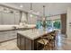 Elegant kitchen with a spacious island, pendant lighting, and stainless steel appliances at 4350 S White Dr, Chandler, AZ 85249