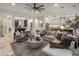 Spacious living room featuring neutral decor, comfortable seating, and a view of the adjacent kitchen and billiards area at 4350 S White Dr, Chandler, AZ 85249
