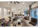 Cozy living room boasts a large sectional sofa, stylish rug, and natural light, perfect for relaxing and entertaining at 4350 S White Dr, Chandler, AZ 85249