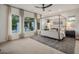 Bright main bedroom with large windows, canopy bed, and ensuite bathroom at 4350 S White Dr, Chandler, AZ 85249