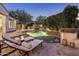 Beautiful pool area with chaise lounges, lush landscaping, and a serene waterfall feature at 4350 S White Dr, Chandler, AZ 85249