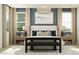 Stylishly staged bedroom featuring modern furniture, large windows, and contemporary decor at 4999 S 233Rd Dr, Buckeye, AZ 85326