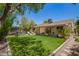 Spacious backyard with lush lawn, hot tub, and lounging area providing a private outdoor retreat at 5350 S River Dr, Tempe, AZ 85283