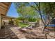 Lush backyard with lounge chairs, a patio, a manicured lawn and a trampoline for outdoor enjoyment at 5350 S River Dr, Tempe, AZ 85283