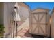Backyard features a storage shed and walking path, providing ample outdoor space at 5350 S River Dr, Tempe, AZ 85283