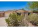 A cozy single-story home showing the garage, a well-manicured front yard, and desert landscaping at 5350 S River Dr, Tempe, AZ 85283