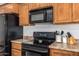 Kitchen featuring stainless steel appliances, and wooden cabinets at 5350 S River Dr, Tempe, AZ 85283