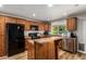 Kitchen with wooden cabinets, granite countertops and stainless steel appliances at 5350 S River Dr, Tempe, AZ 85283