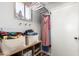 Functional mudroom features ample storage, shelving, and convenient hooks near the entry door at 5350 S River Dr, Tempe, AZ 85283