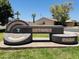 An Optimist Park sign in a vibrant green space in a community with trees and well-kept grass at 5350 S River Dr, Tempe, AZ 85283