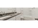 Bright bathroom features double sinks with granite countertops, a bathtub and toilet at 653 W Freedom St, Florence, AZ 85132
