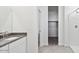 Bathroom sink with granite counters and a shower featuring built in shelves and natural light at 653 W Freedom St, Florence, AZ 85132