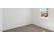 Bright bedroom features neutral carpet, fresh white paint, and a window for natural light at 653 W Freedom St, Florence, AZ 85132