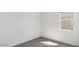 Bright bedroom space featuring neutral-colored carpet and natural light from window at 653 W Freedom St, Florence, AZ 85132