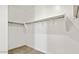Spacious walk-in closet features built-in shelves and ample storage space at 653 W Freedom St, Florence, AZ 85132